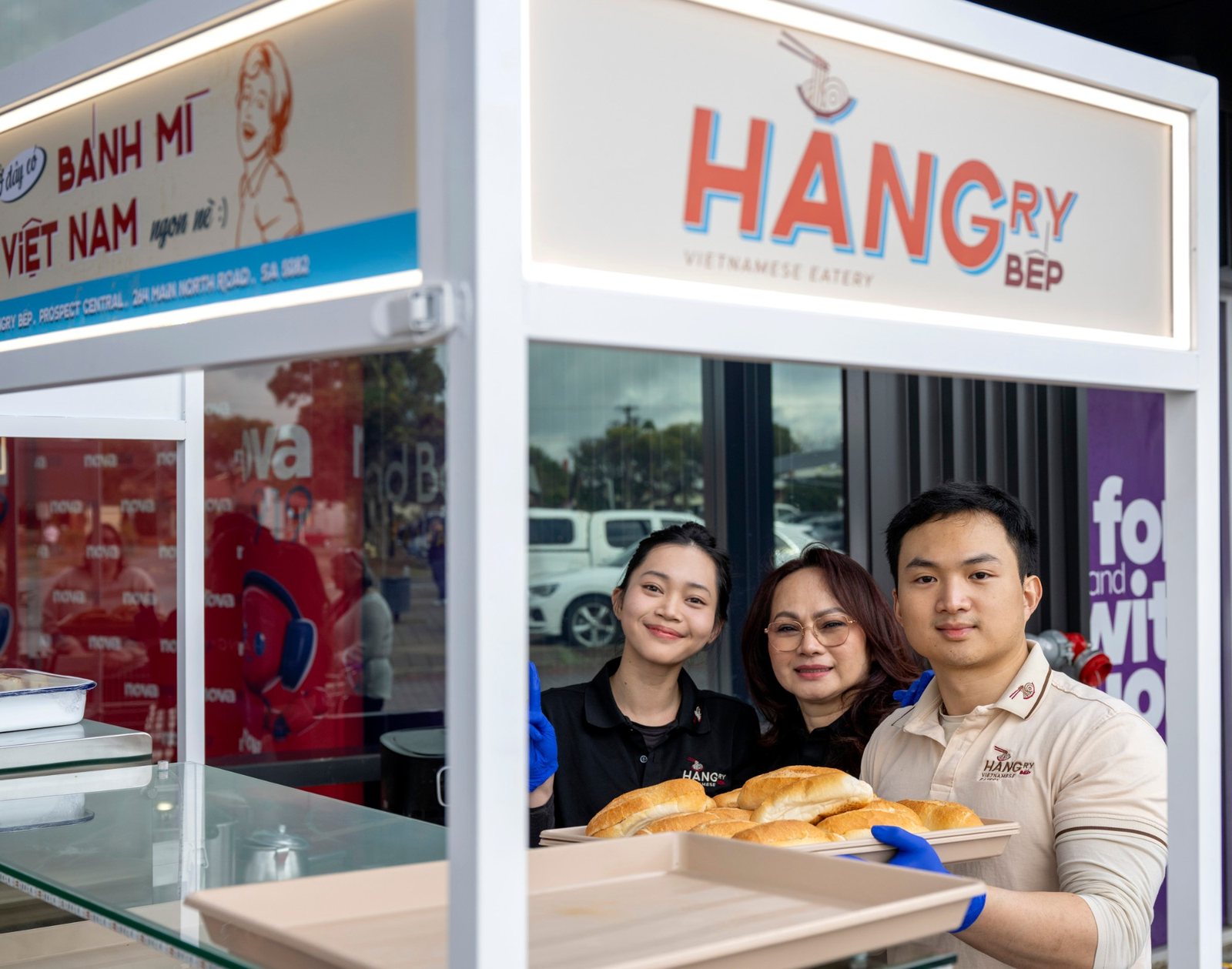 The HANGry Bếp team serving fresh bánh mì at the Prospect Central grand opening