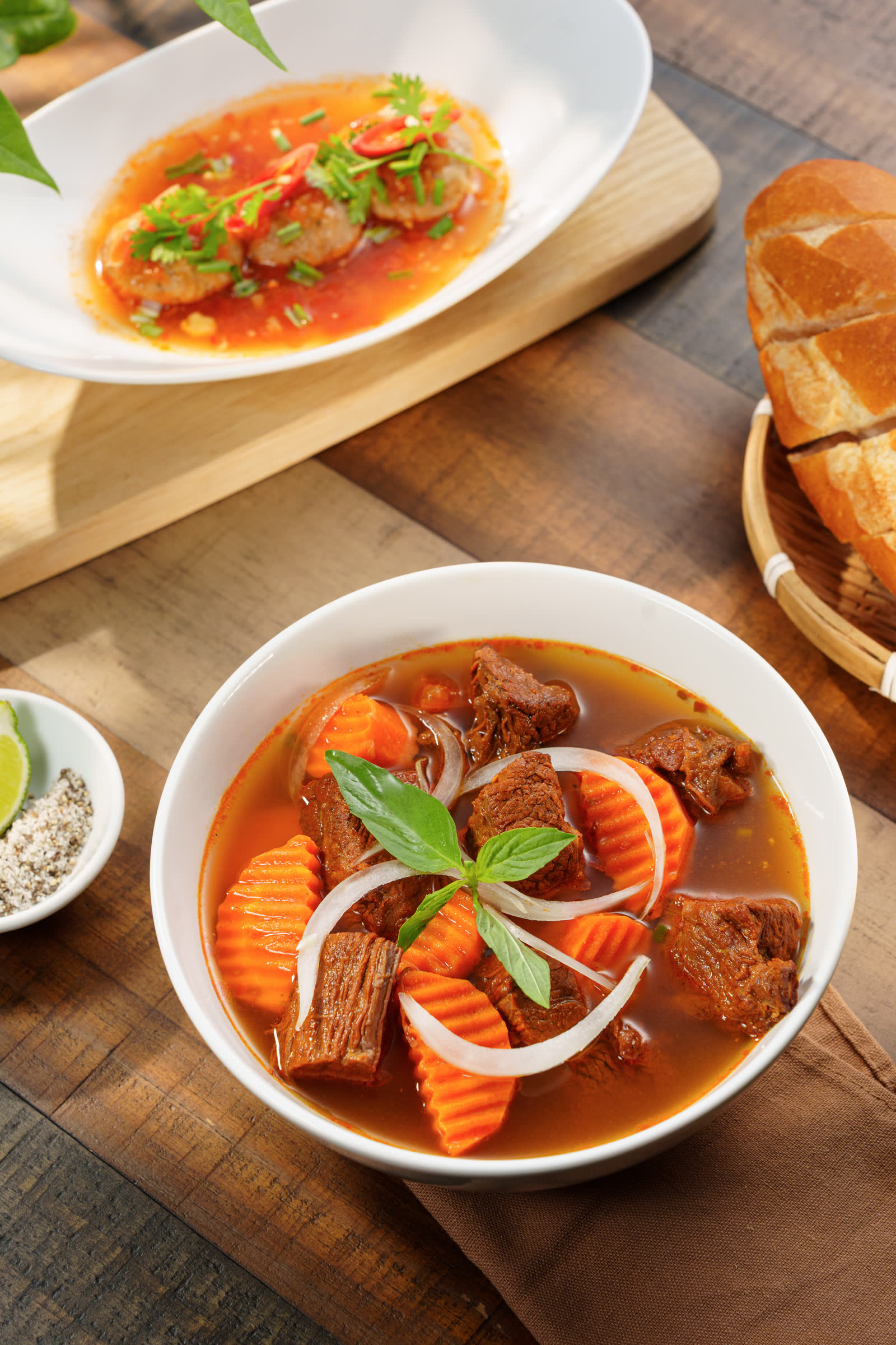 Vietnamese beef stew with baguette and pork meatballs on the table